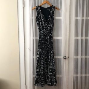 Long sleeveless black & white polkadot dress.